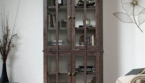 Curio Cabinet A Tall And Skinny Cabinet With Glass Doors And Panels