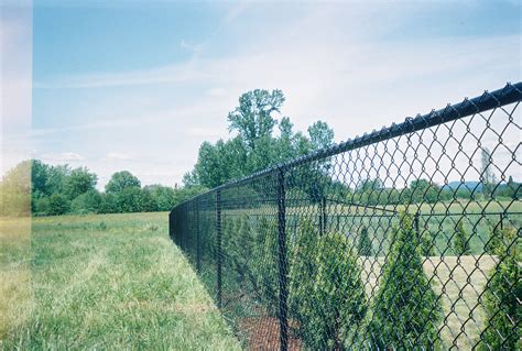 tall chain link fence posts