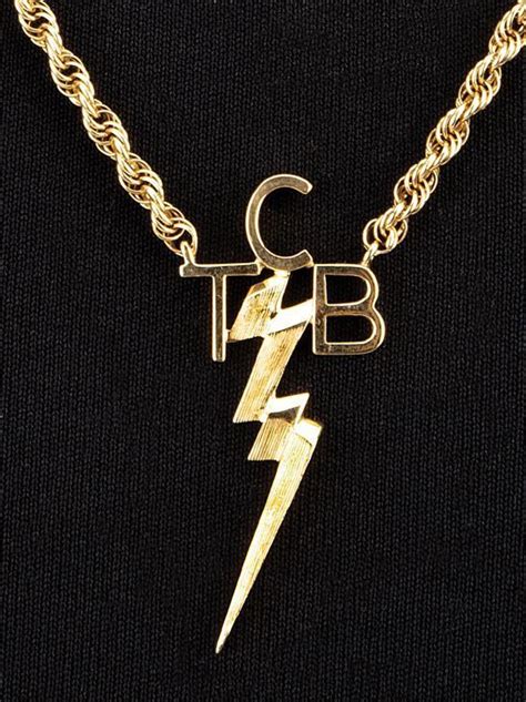 tcb necklace worn by elvis