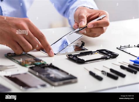 technician fixing phone screen