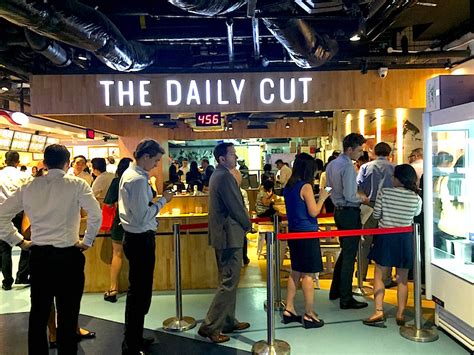 the daily cut raffles place