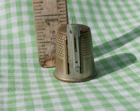 Thimble With Thread Cutter