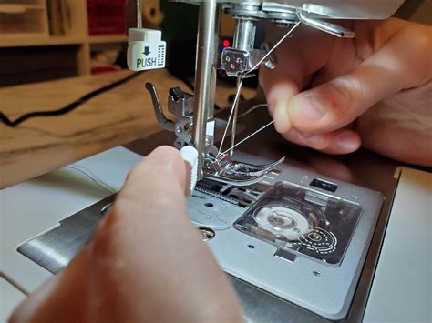 threading needle on singer sewing machine