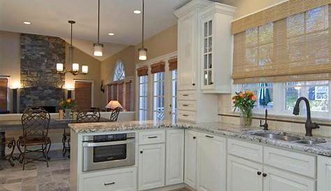 Marble look tile flooring in a white kitchen with shaker and