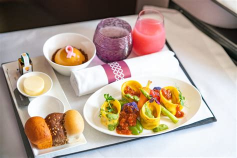 top flight attendant offering vegan meals