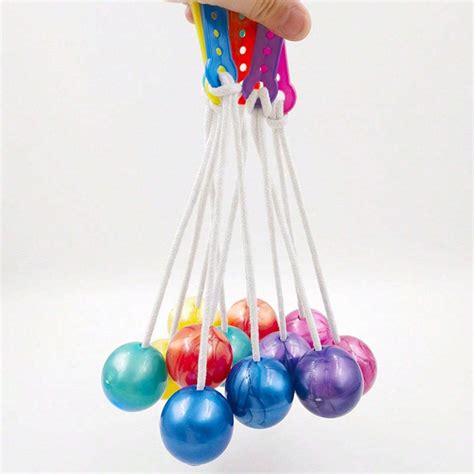 Toy With 2 Balls On A String