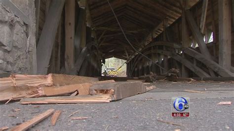 tractor trailer hits covered bridge