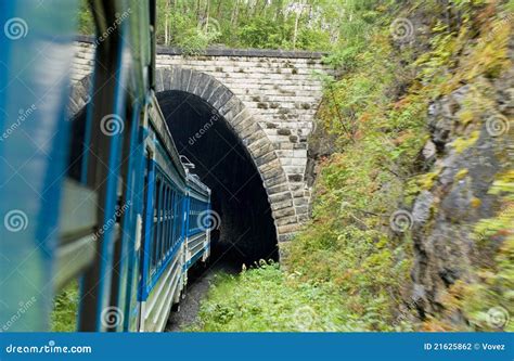 train going through small tunnel