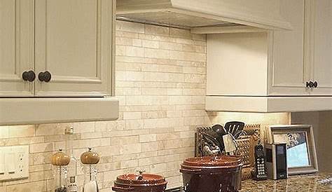 A Small Glass Mosaic Insert Punches Up The Look Of This Travertine