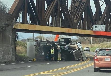 truck hits bridge liverpool ny