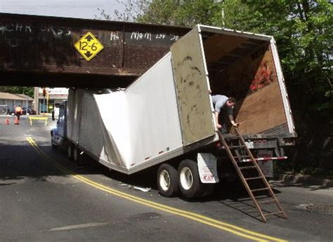 truck stuck under bridge