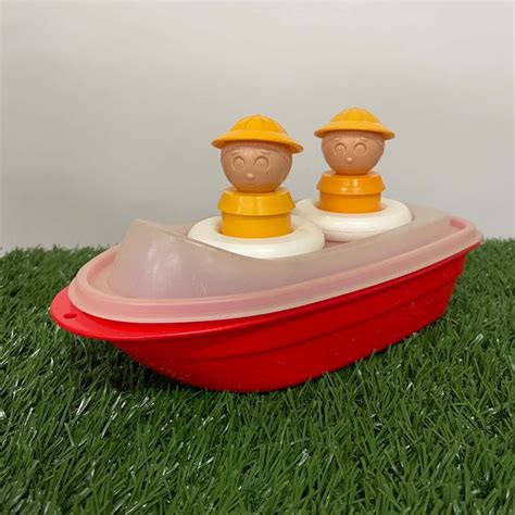 toy Adirondack wooden canoe with green & white painted paddle, vintage