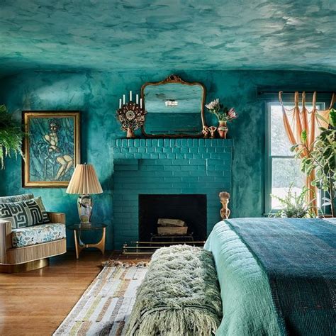 Image of a turquoise bedroom with white accents and a pop of yellow