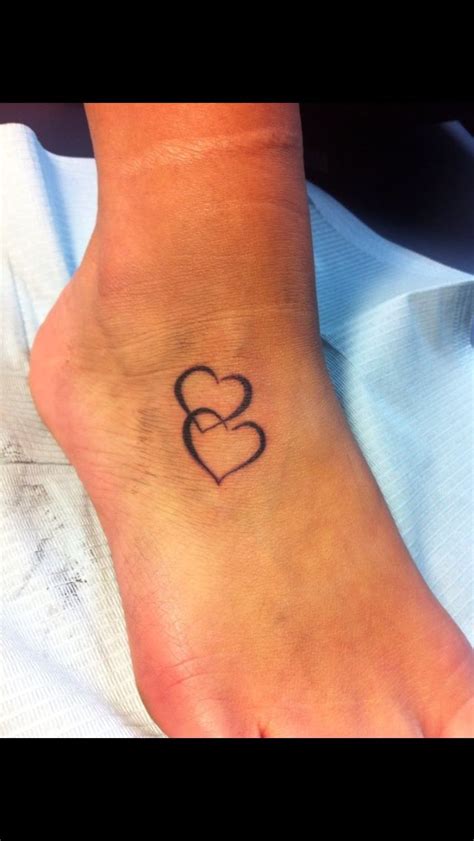 Two Hearts Intertwined Tattoos