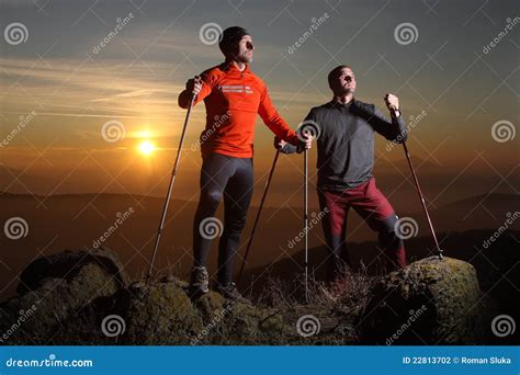 two hikers at the top