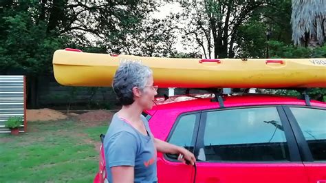 tying kayak to roof rack with rope