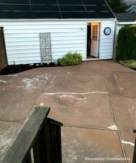 Before and after photo of a Concrete patio cleaning we completed. Call