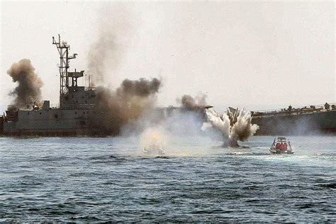 us navy fires on iranian ship