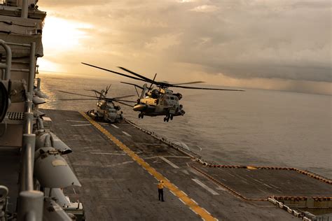 U.S. Capitol building with flexed arm in foreground