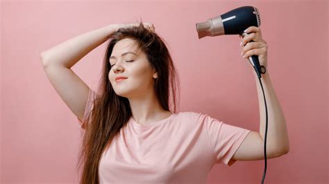 Using A Blow Dryer To Dry Your Hair Is An Example Of