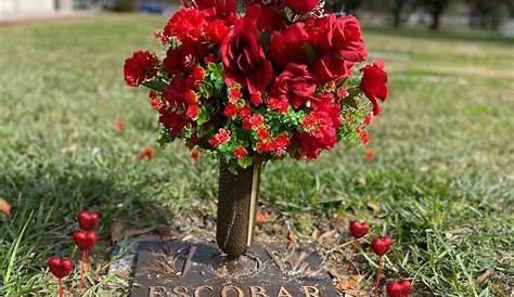 Valentine's Day Grave Decorations A Bouquet Of Flowers Sitting On The Ground