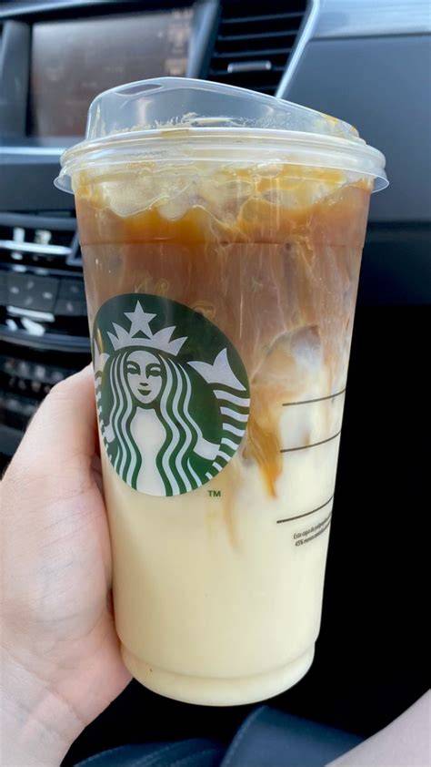 Iced Venti Caramel Macchiato with hazelnut syrup & whipped cream