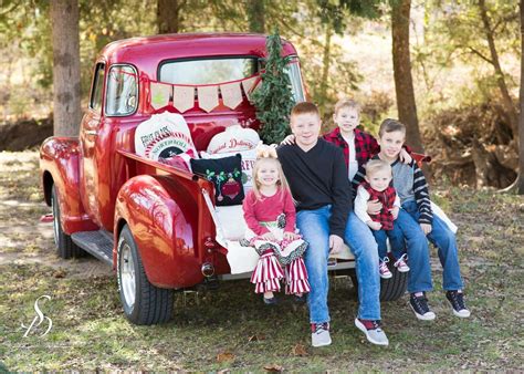 Christmas Mini session w/Vintage red Chevrolet truck. familyphotography Copyright Sabrina Duck