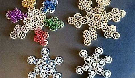 We made snowflakes out of wagon wheel pasta.. hot glued
