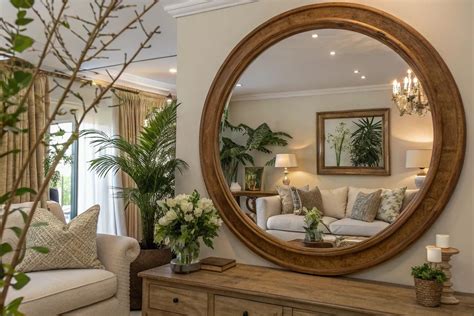 Wall Decor Next To Round Mirror