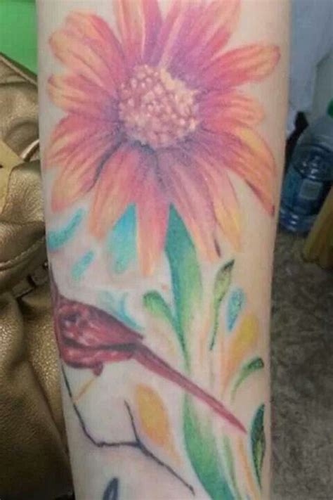 No outline watercolor flower tattoo on arm Flower tattoo