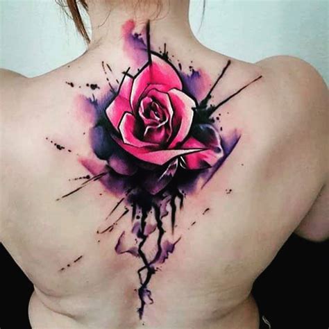 Watercolor cherry blossom tattoo on the upper back