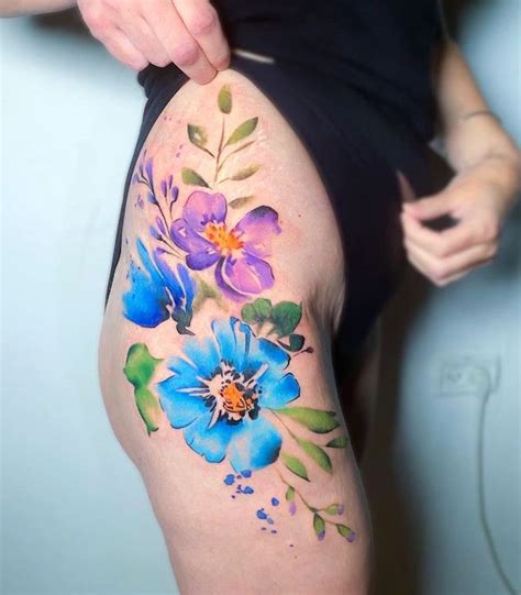 Great watercolor flower tattoo on hip Magnolia tattoo