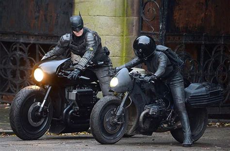 wearing motorcycle helmet batman catwoman