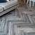 weathered grey herringbone laminate flooring