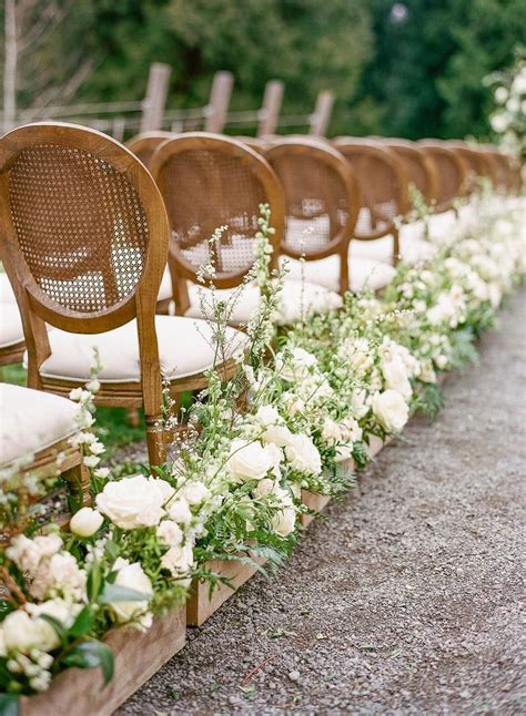 Cascading Greenery and White Flower Aisle Arrangements Wedding aisle