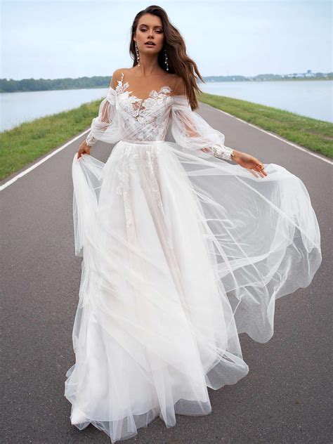 Wedding dress with offtheshoulder sleeves
