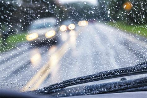 Image of a car driving on a wet road