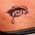 what does a tattooed teardrop under the eye mean?