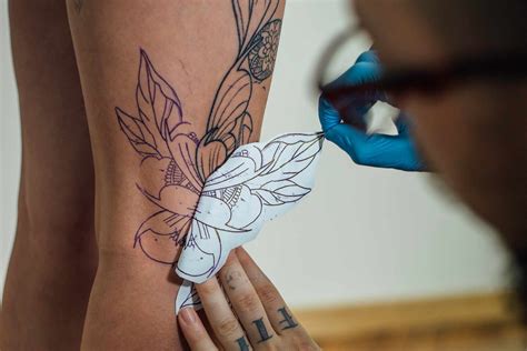 Tattooer Showing Process Of Making A Tattoo. Tattoo Design Stock Photo