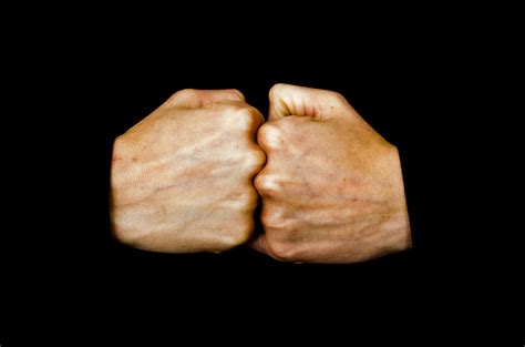 what does hitting your fists together mean