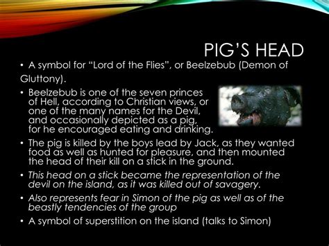 What does the pig's head on a stick symbolize?