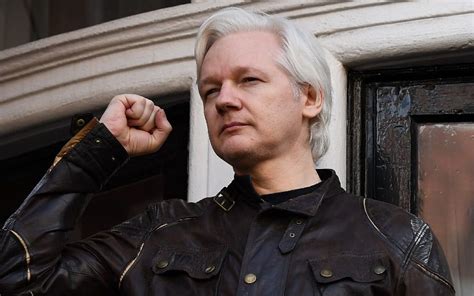 when was julian assange charged