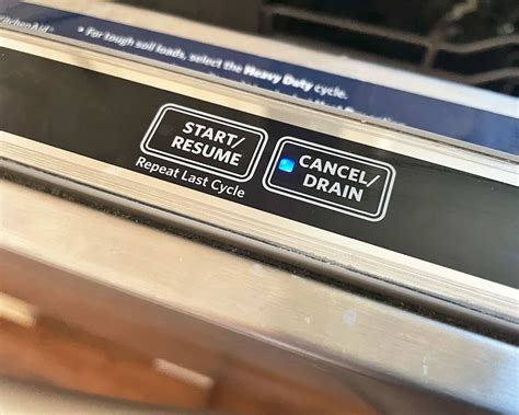 whirlpool dishwasher drain button