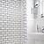 white bathroom floor tile with black grout