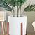 white ceramic and wood planter