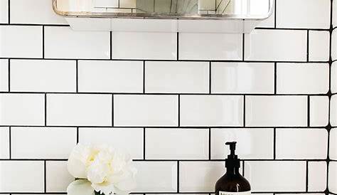 White tiles, grey floors and brass accents COCO LAPINE DESIGNCOCO