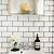 white wall tiles with dark grout