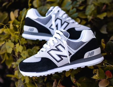 white and black new balance 574