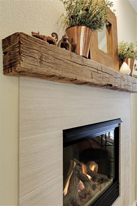 white fireplace with reclaimed wood mantel