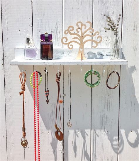 White Floating Shelf With Hooks